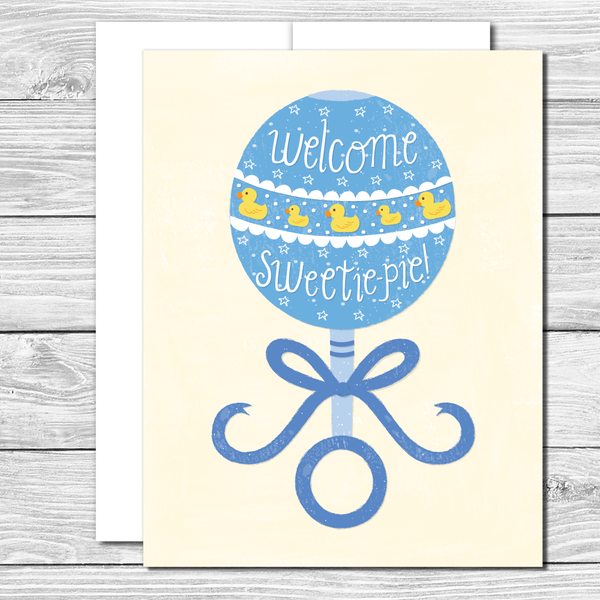 Welcome sweetie pie! Hand drawn blue rattle greeting card